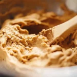 Perfect cookie batter ready for baking in a mixing bowl.